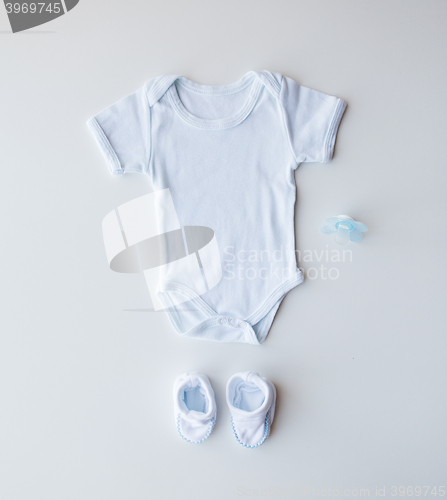 Image of close up of baby boys clothes for newborn on table