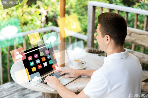 Image of close up of businessman with laptop on terrace