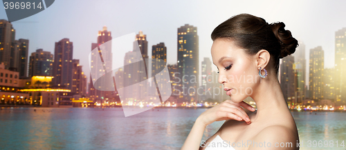 Image of close up of beautiful woman face with earring