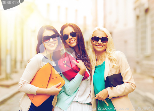 Image of beautiful girls with bags in the ctiy