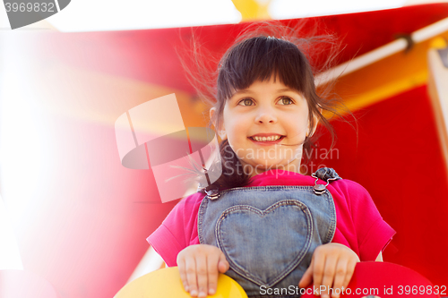 Image of happy little girl on children playground