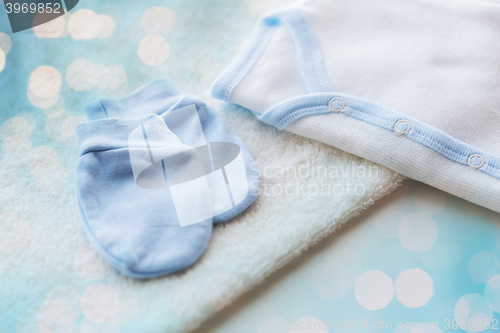 Image of close up of baby boys clothes for newborn on table