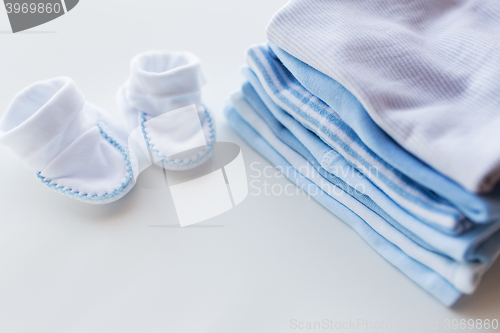 Image of close up of baby boys clothes for newborn on table