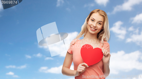 Image of happy woman or teen girl with red heart shape