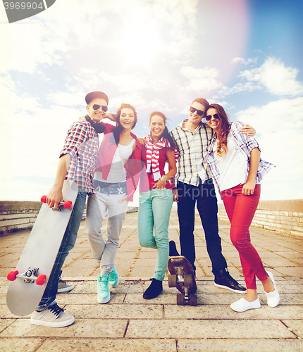 Image of teenagers with skates outside