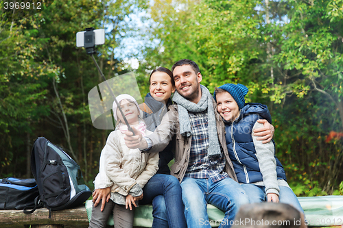 Image of happy family with backpacks hiking