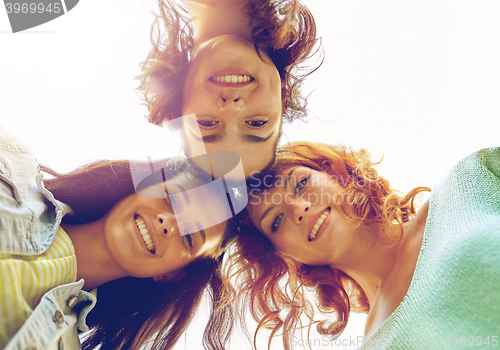 Image of happy young women or teenage girls in circle