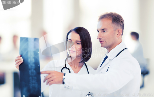 Image of two doctors looking at x-ray