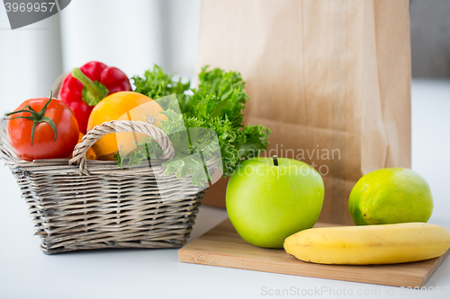 Image of basket of fresh friuts and vegetables at kitchen