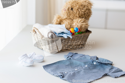 Image of close up of baby clothes and toys for newborn