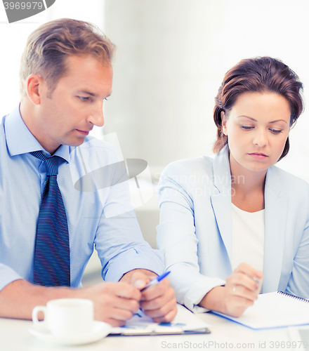 Image of business team discussing something in office