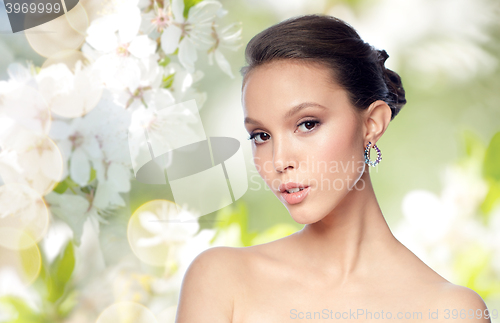 Image of close up of beautiful woman face with earring