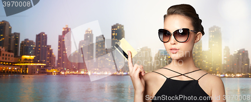 Image of beautiful young woman in elegant black sunglasses