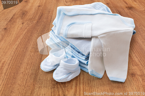 Image of close up of baby boys clothes for newborn on table