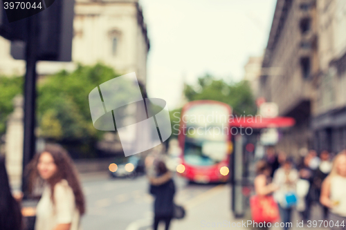 Image of city street with people and transport in london