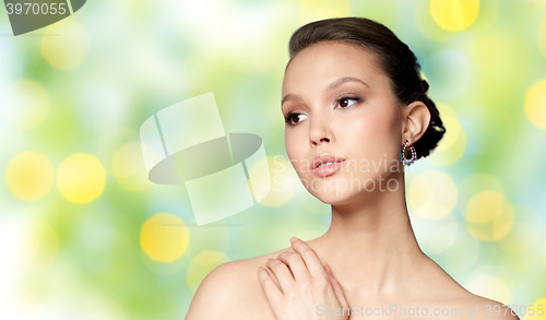 Image of close up of beautiful woman face with earring