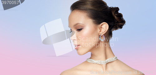 Image of close up of beautiful woman face with earring