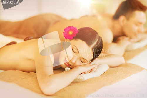 Image of couple in spa with hot stones