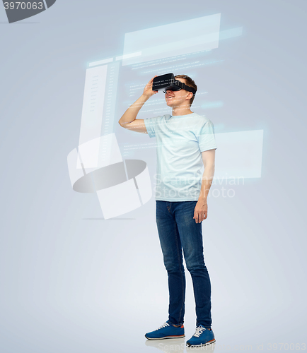 Image of happy man in virtual reality headset or 3d glasses