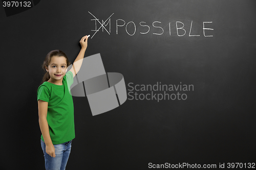 Image of Girl writing in a blackboard