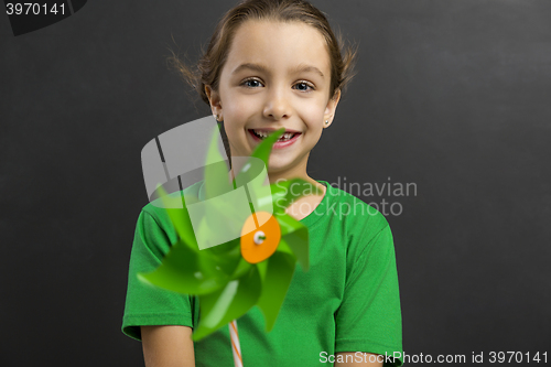 Image of Little girl holding a windmill