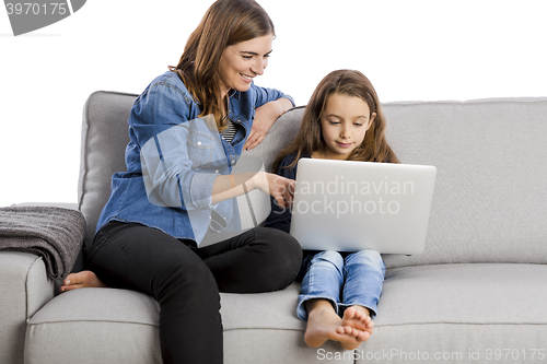 Image of Mother teaching her little daughter