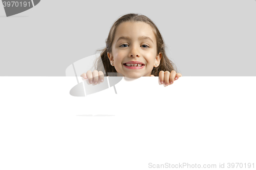 Image of Cute girl holding a blankboard