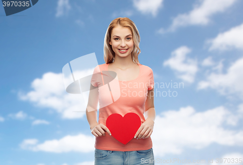 Image of happy woman or teen girl with red heart shape