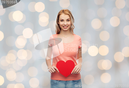 Image of happy woman or teen girl with red heart shape