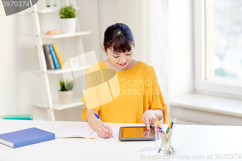 Image of asian woman student with tablet pc at home