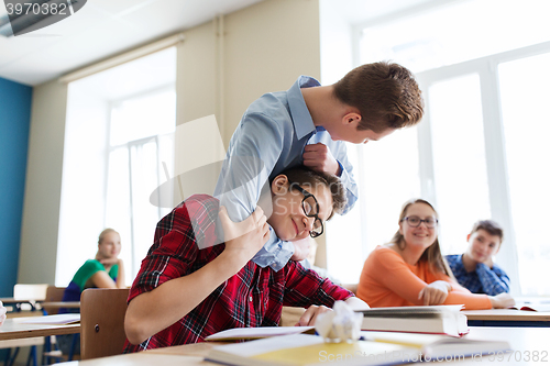 Image of student boy suffering of classmate mockery