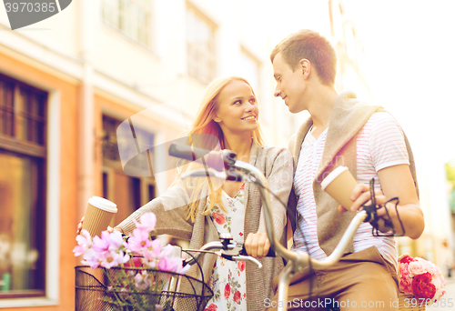 Image of couple with bicycles in the city