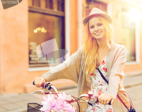 Image of attractive woman with bicycle in the city