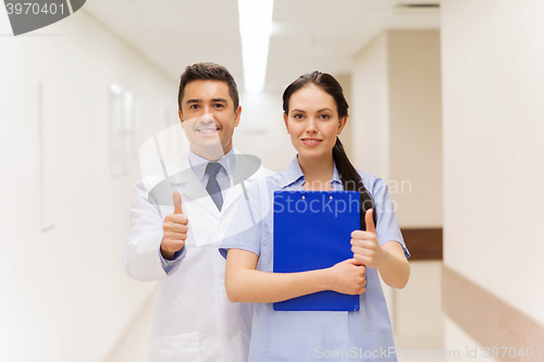 Image of doctor and nurse showing thumbs up at hospital