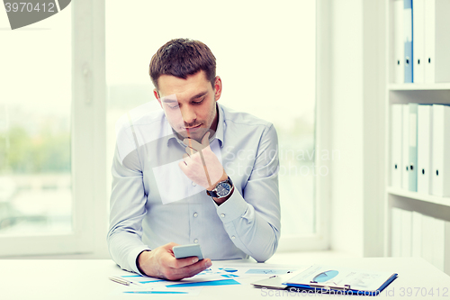 Image of close up of businessman with smartphone