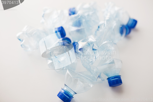 Image of close up of empty used plastic bottles on table