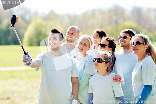 Image of group of volunteers taking smartphone selfie