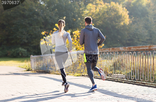 Image of couple running or jogging outdoors