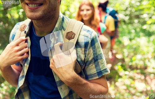 Image of close up of friends with backpacks hiking