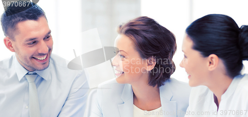 Image of business team discussing something in office