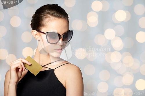 Image of beautiful young woman in elegant black sunglasses