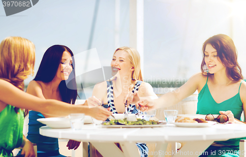 Image of girls in cafe on the beach