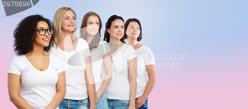 Image of group of happy different women in white t-shirts