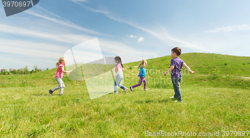 Image of group of happy kids running outdoors