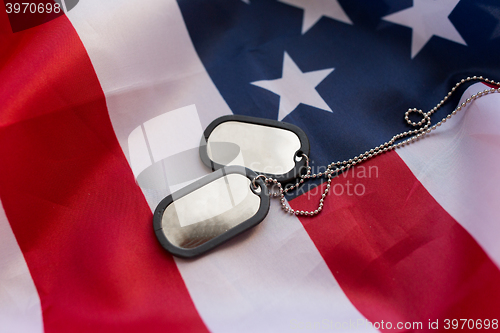 Image of close up of american flag and military badges