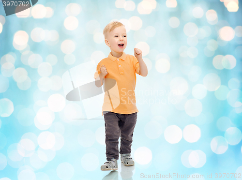 Image of happy little boy in casual clothes