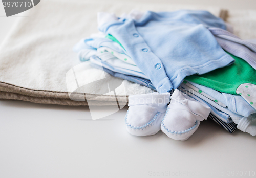 Image of close up of baby boys clothes for newborn on table