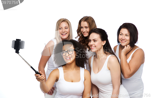 Image of group of happy women taking selfie by smartphoone