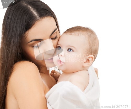 Image of mother kissing adorable baby