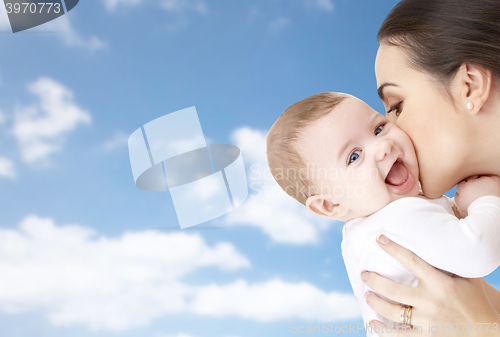 Image of happy mother kissing adorable baby